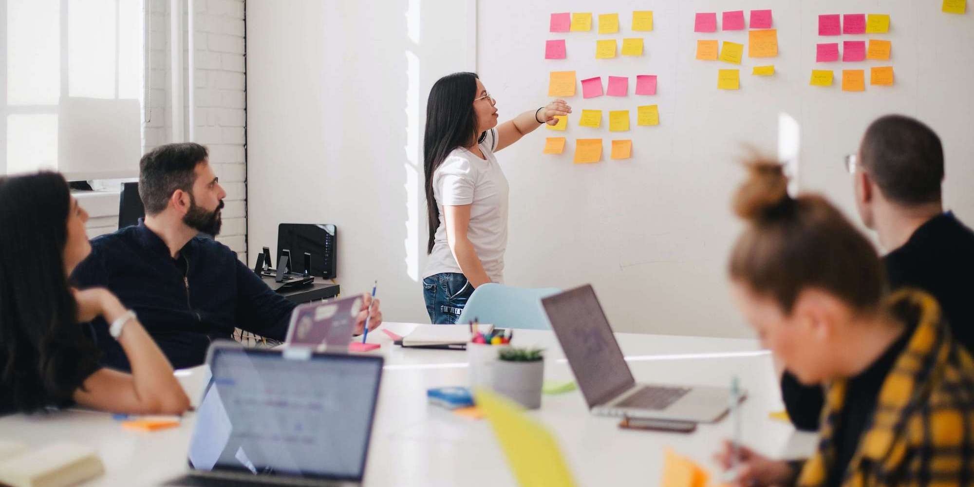 Photo showing a group of people attending training in a meeting room. Image from Unsplash (Photographer - Jason Goodman)