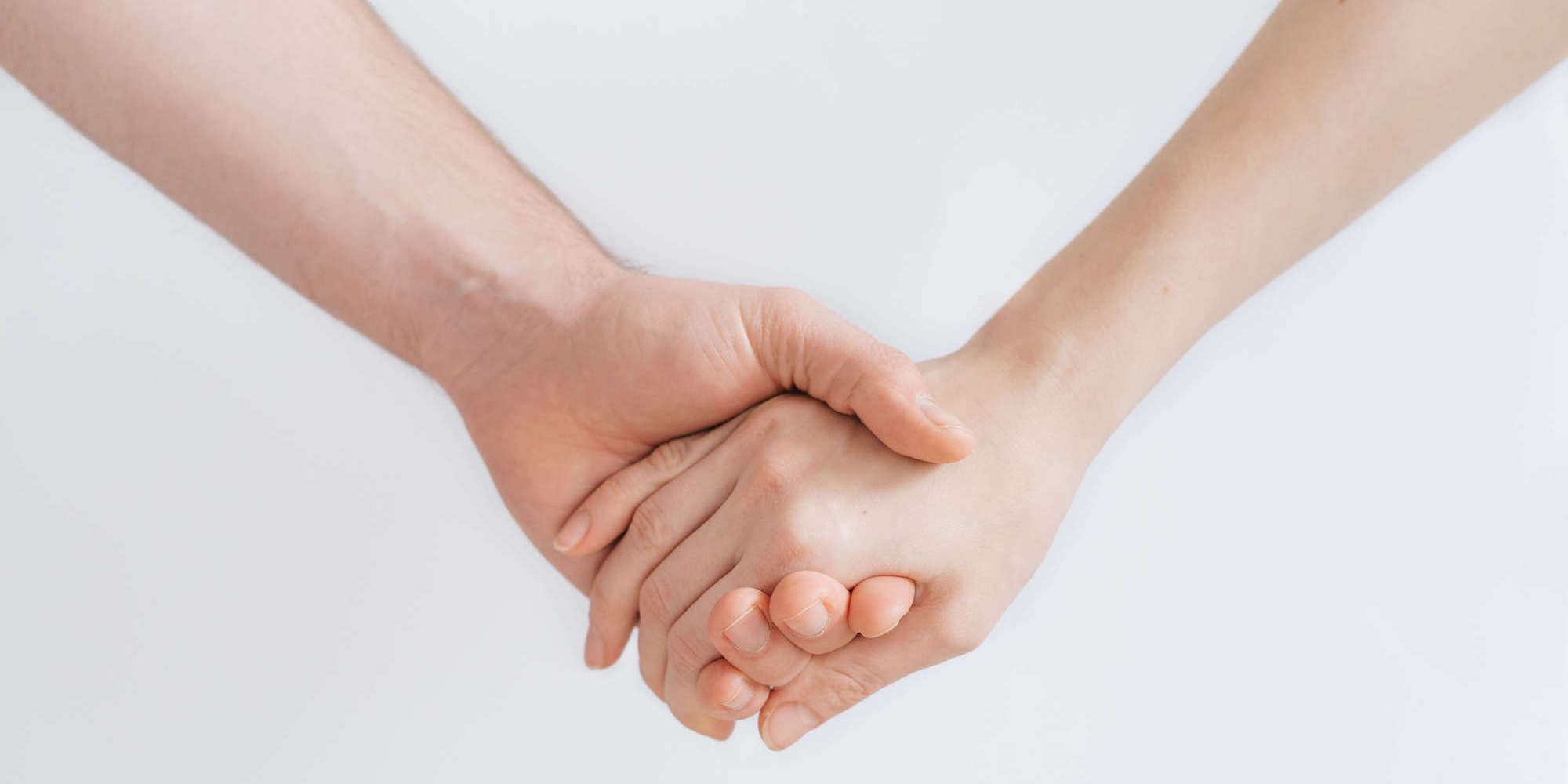 A photo showing holding hands. Unsplash (Photographer - Roman Kraft)